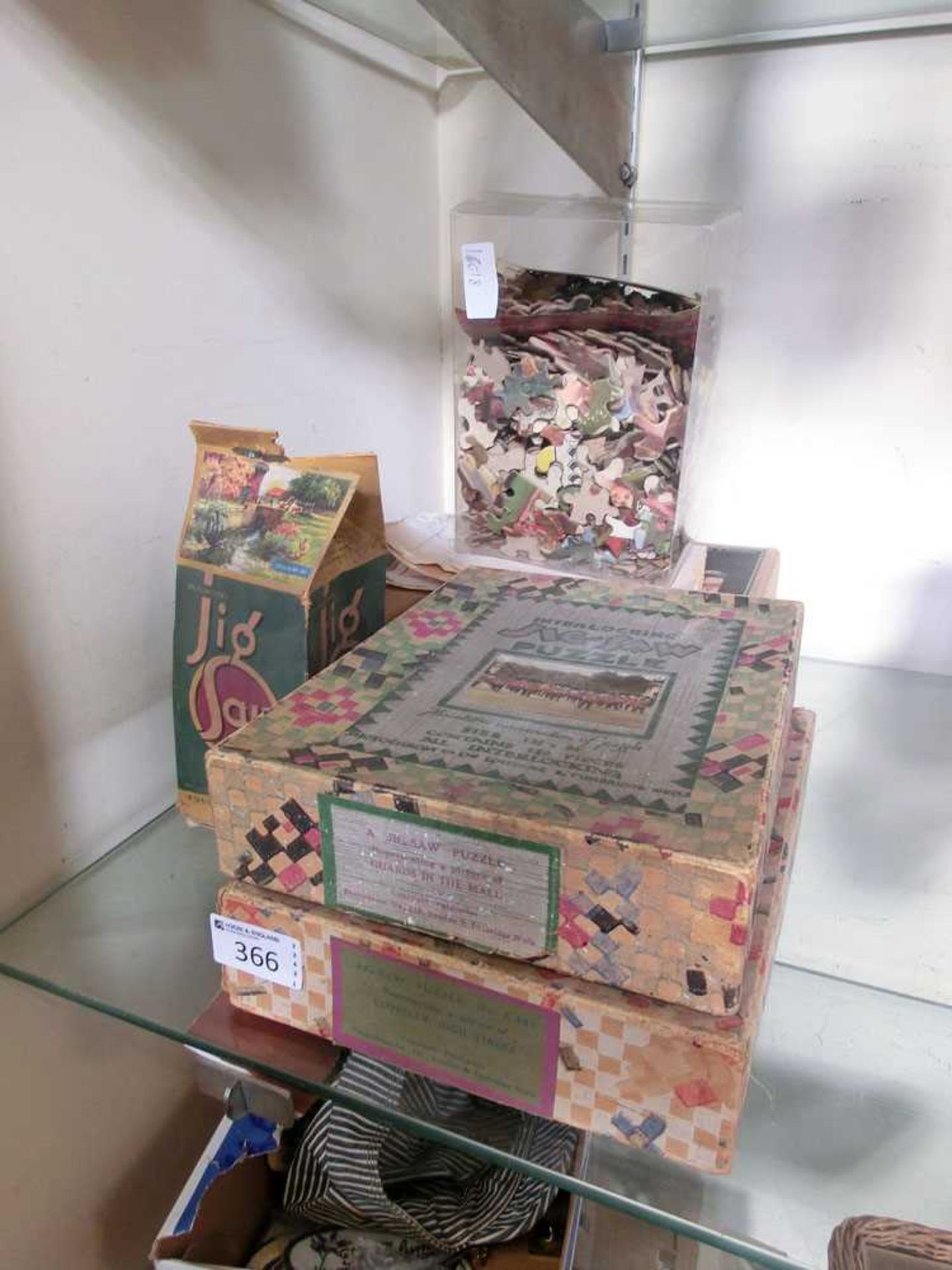 A selection of 20th century boxed and unboxed jigsaw puzzles