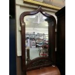 An early 20th century bevel glass mirror