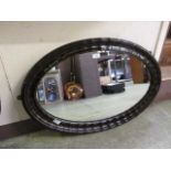 An early 20th century oval mirror