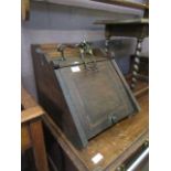 An early 20th century oak coal box