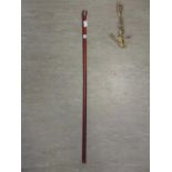 A silver topped walking stick