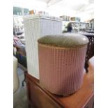 A white painted Lloyd Loom ottoman together with a pink painted Lloyd Loom ottoman with padded seat
