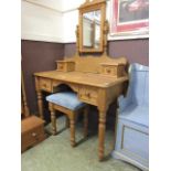 A modern pine dressing table with swing mirror to back and trinket drawers together with a