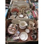 Two trays of decorative ceramic ware to include meat plates, wall plates, water jugs, etc