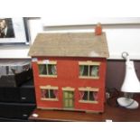 An early 20th century hand crafted doll's house