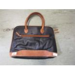 An as new black and tan leather handbag