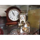 A reproduction Westminster chime London clock togethee with a carriage clock and three miniature