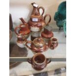 A selection of Doulton Lambeth teaware to include cream jugs, teapot, water jug, etc