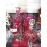 Seven items of cranberry glassware