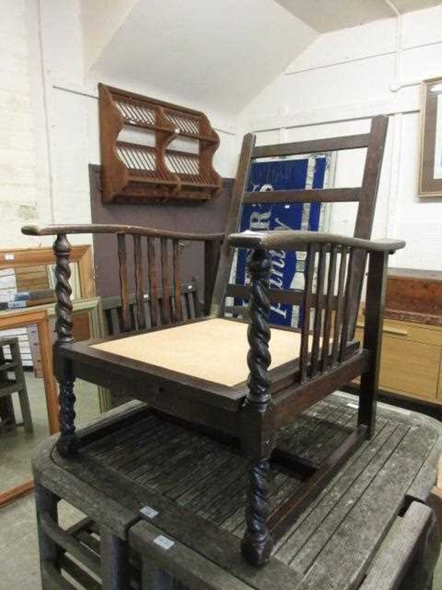 An early 20th century oak arm chair