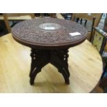 An eastern hardwood carved top collapsible occasional table