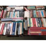 Four trays of hardback books, mainly relating to travel