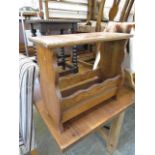 A mid-20th century occasional table with magazine rack