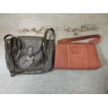 A green ostrich leather handbag together with an ostrich leather brown handbag