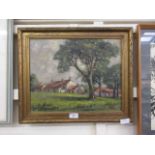 A gilt framed oil of a country cottage scene