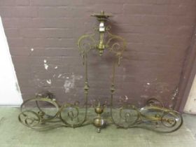 An early 20th century brass billiard table ceiling hanging light fitting