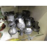 A selection of pewter and silver plated items to include cream jugs, tankards, teapot, etc