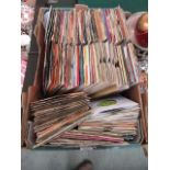 A tray containing a quantity of 45rpm records by various artists