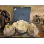 A selection of white Wedgwood tableware to include cups, saucers, centrepiece, etc with box