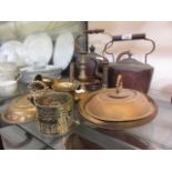 A selection of metalware to include brass candlesticks, copper kettle, plated candle holder, etc