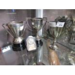 A selection of three silver plated trophies, one of which relating to Silverstone 1962, along with a