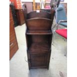 An early 20th century oak bookcase with drawer to base
