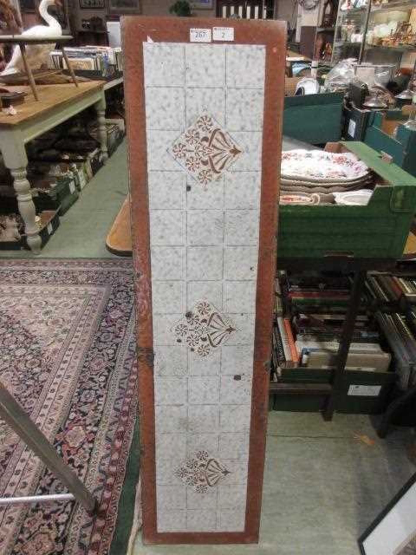 An early 20th century enamelled splash back