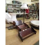 Three book troughs together with two turned wooden table lamps and an early 20th century oak book