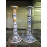 A pair of blue and white ceramic candlesticks (A/F)