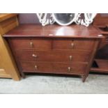 An early 20th century chest of two short over two long drawers