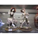 Two Capodimonte style figurines, one of a lady with a sheep, the other of a man with a sheep