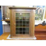 A 19th century oak leaded glazed wall mounted cupboard