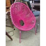 A mid-20th century pink elastic tub chair