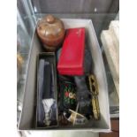 A box containing a selection of collectable items to include pens, nutcrackers, wooden canister