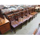 A set of twelve mid-20th century rail back dining chairs