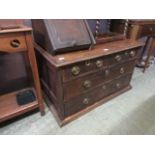 A 19th century oak chest of two short over two long drawers