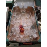 A tray containing a quantity of cut glassware to include decanters, paperweights, etc