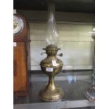 A brass effect oil lamp