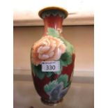 A red ground cloisonné vase with gilt and floral design