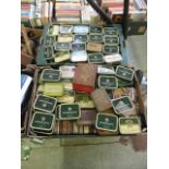Two trays containing a large quantity of tins containing spare fittings etc