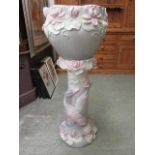 A large ceramic floral decorated jardiniere stand with bowl