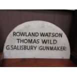 A sign marked 'Rowland Watson, Thomas Wild, G.Salisbury (Gunmaker)'