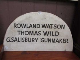 A sign marked 'Rowland Watson, Thomas Wild, G.Salisbury (Gunmaker)'
