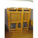 A pair of wooden folding chairs
