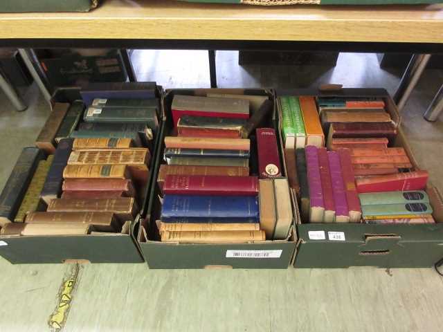 Three trays of hardback books by various authors