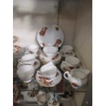 A part Royal Vale tea set comprising of cups, saucers, side plates, cream and sugar bowls