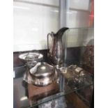 A selection of plated and white metal items to include claret jug, burner,muffin dish, etc