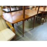 A mid-20th century teak drop leaf table