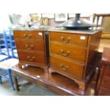 A pair of reproduction mahogany effect three drawer bedside chests