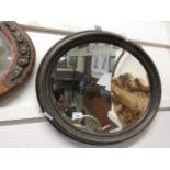 An oval bevel glass mirror
